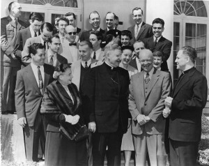 Father Gilbert Hartke with President Eisenhower and students in 1955