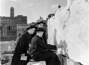 NAC students inspecting an inscription in the Forum, 1954.